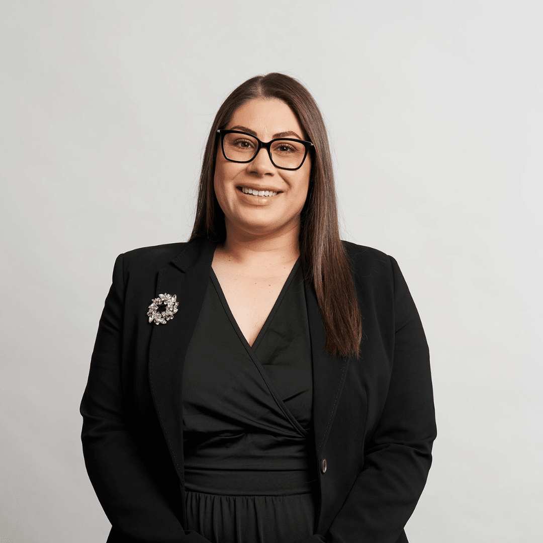 Professional female lawyer in black blazer and dress